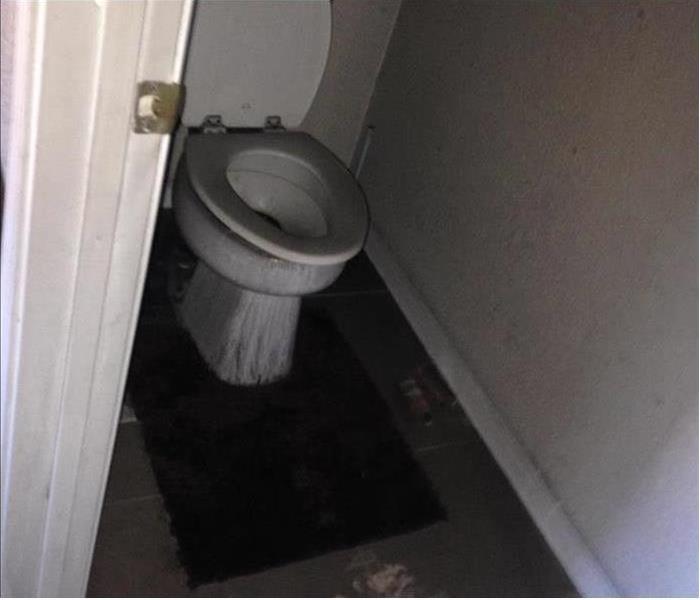 Bathroom and toilet covered in soot